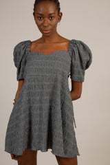 Black and white textured off shoulder mini dress