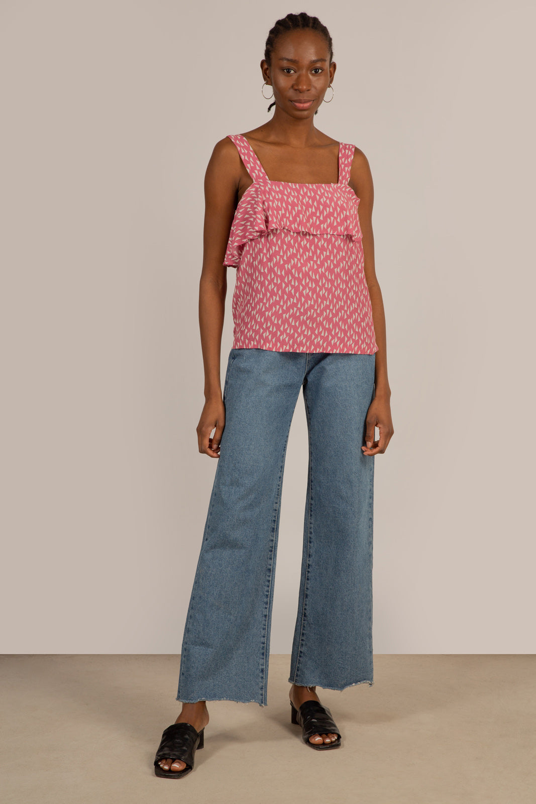 Pink and white triangle print ruffle tank