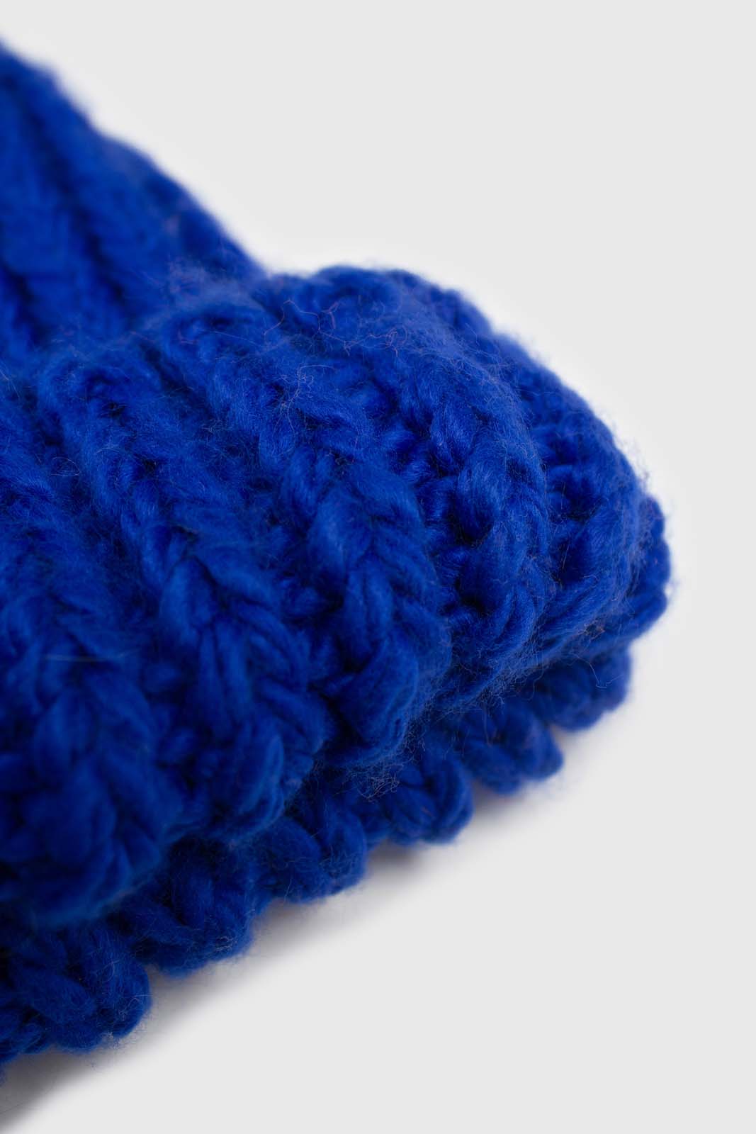 Cobalt blue ribbed black feather pom pom hat