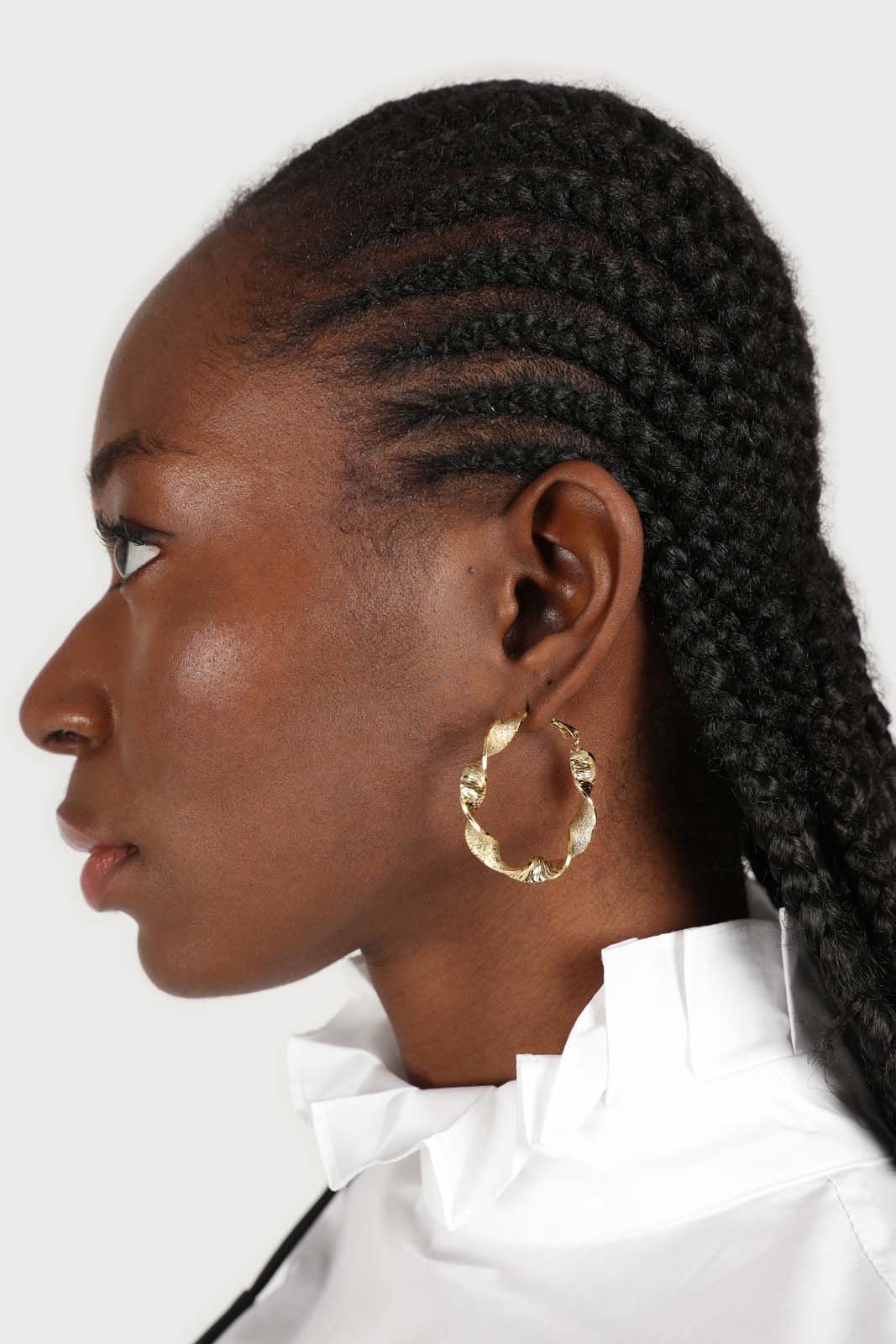 Gold rough smooth twisted hoop earrings