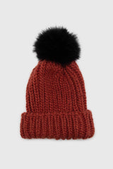 Rusty orange ribbed black feather pom pom hat