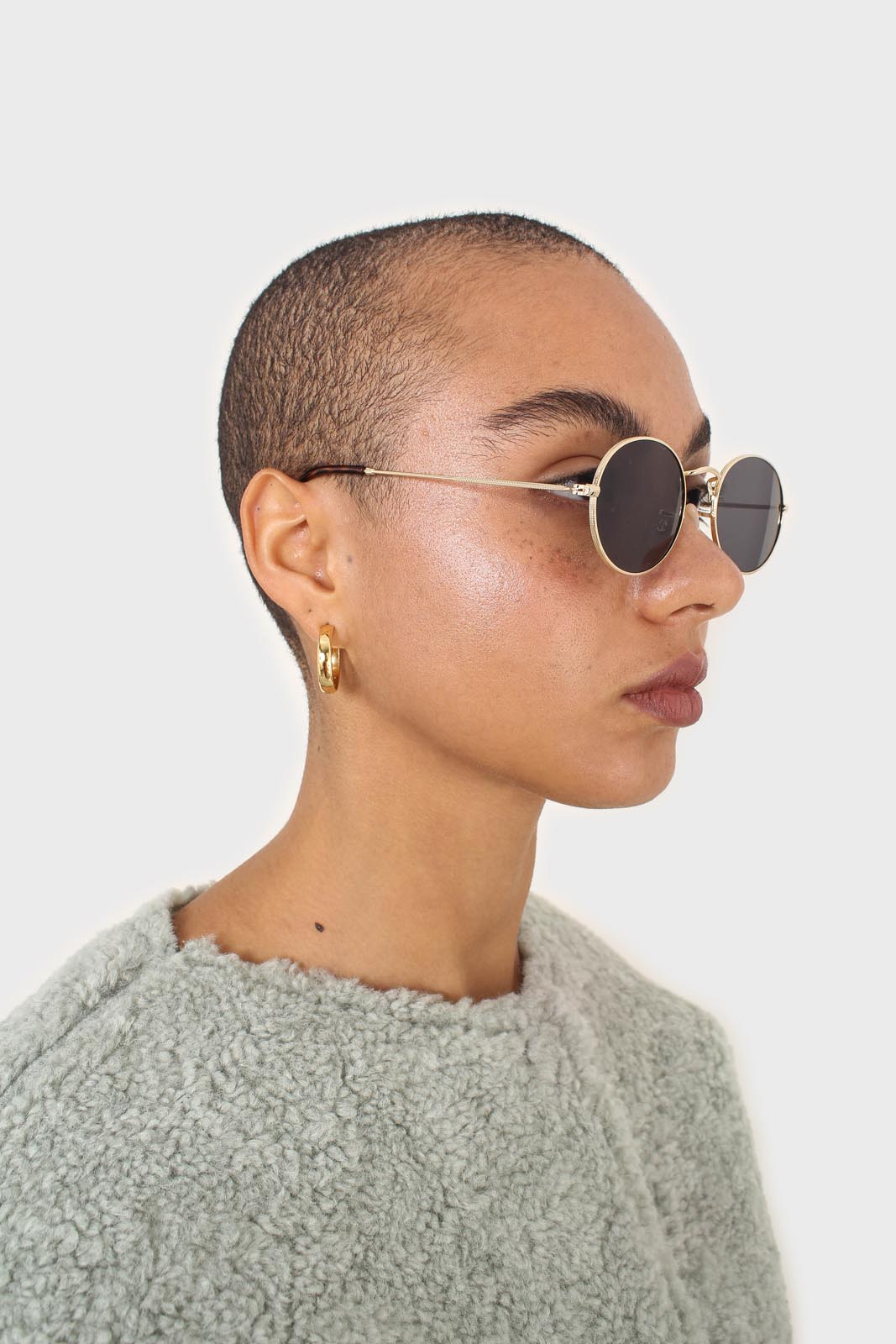 Black gold frame small oval lens sunglasses