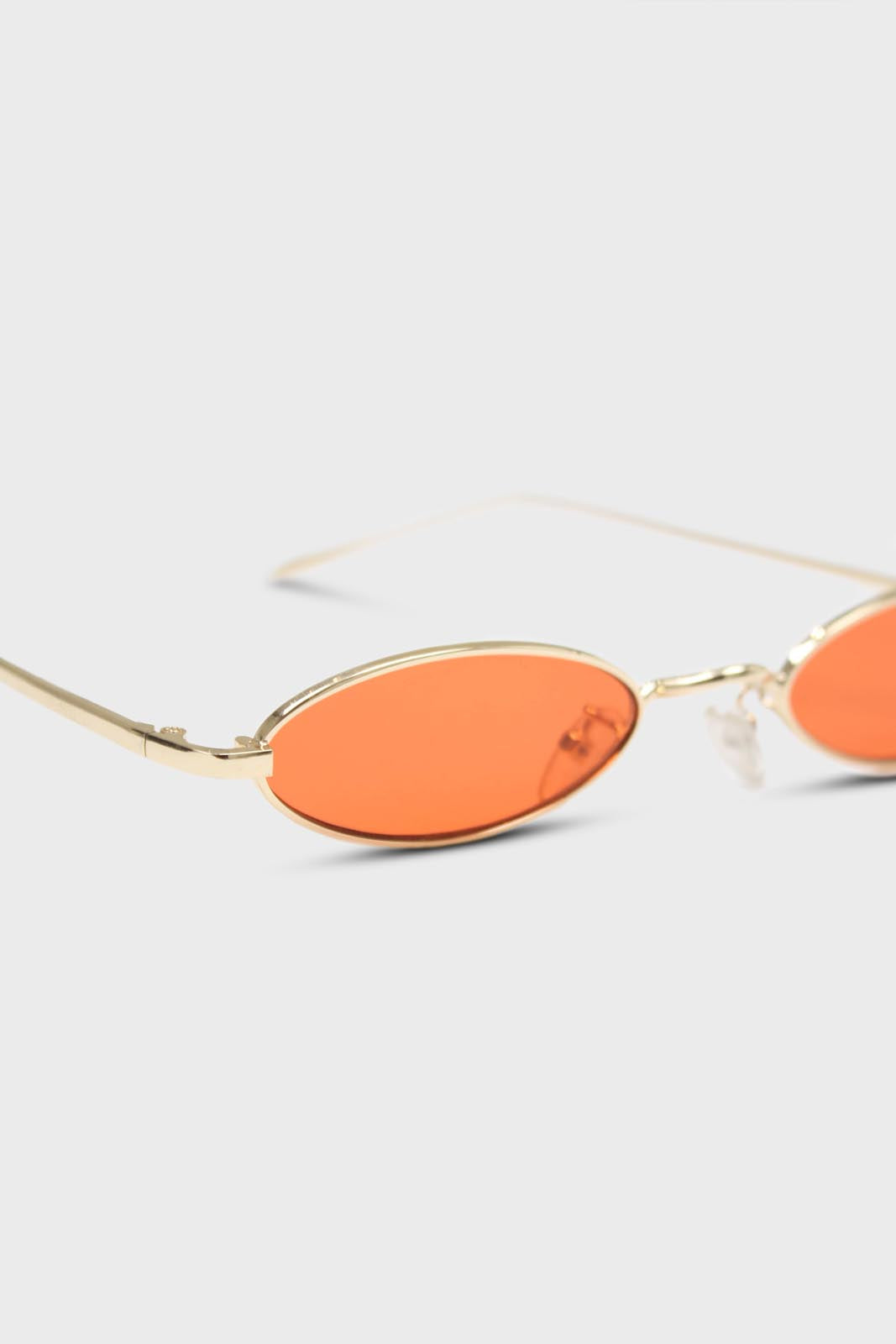 Red and gold lined slim oval sunglasses
