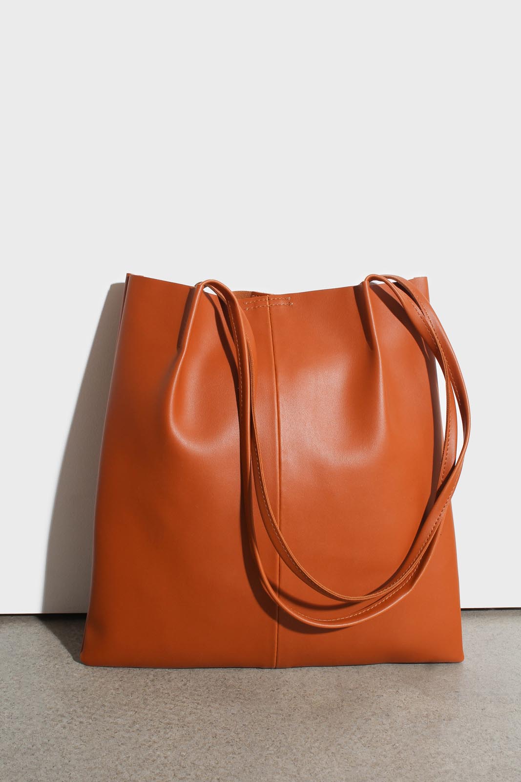 Camel vegan leather pinched strap tote bag