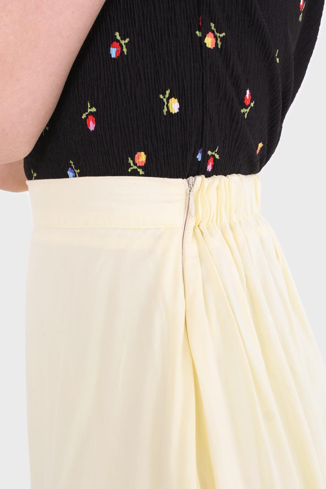 Pale yellow asymmetric hem midi skirt