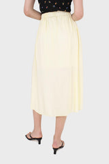 Pale yellow asymmetric hem midi skirt