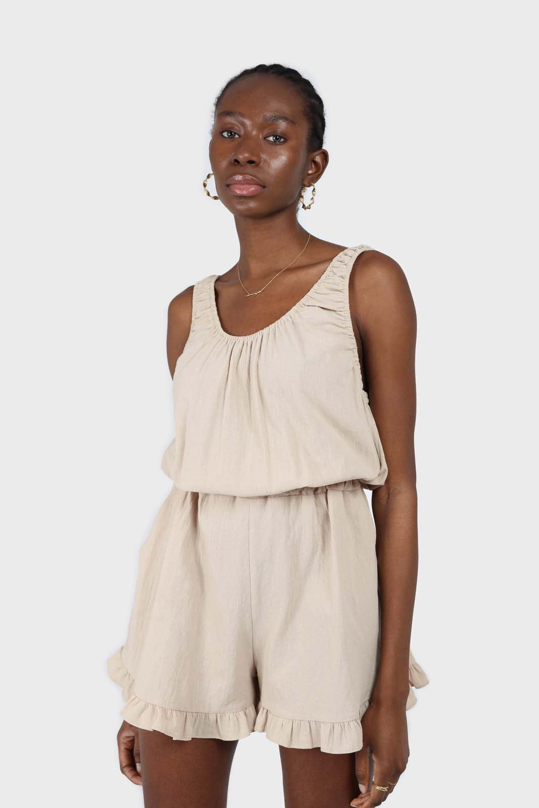 Beige ruffle hem sleeveless romper