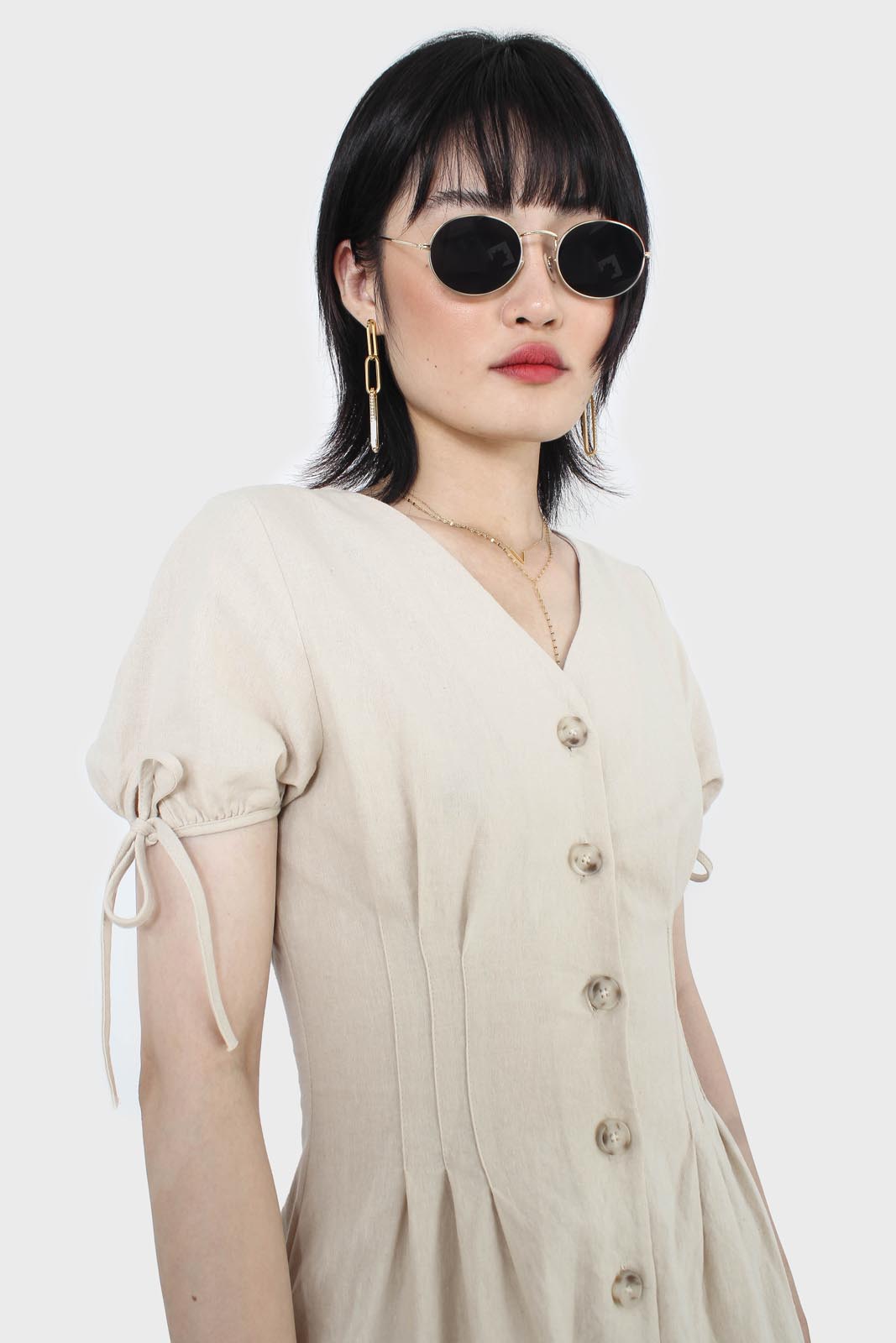 Beige V-neck tie sleeved linen romper