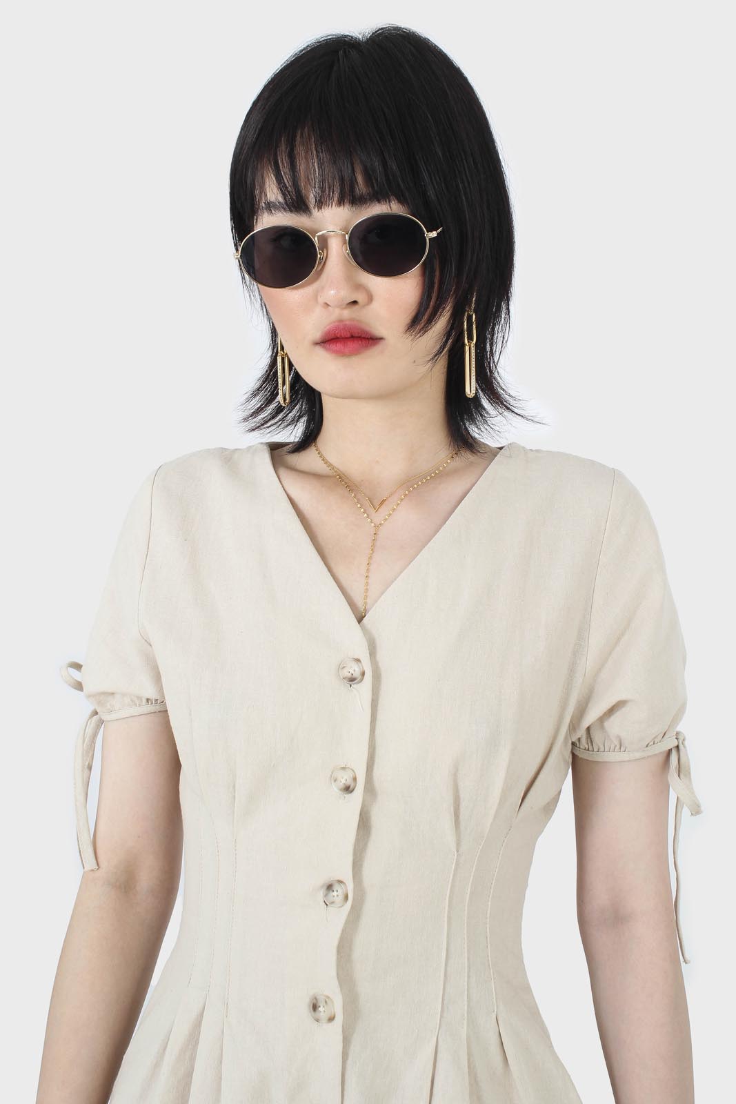 Beige V-neck tie sleeved linen romper