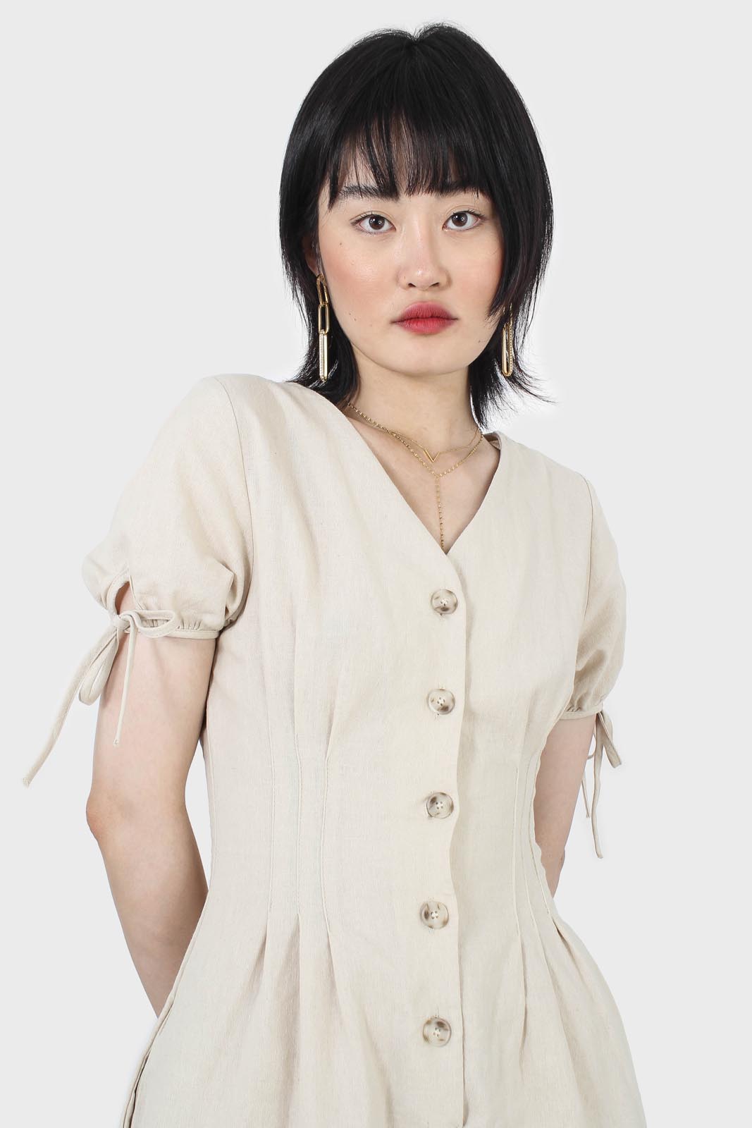 Beige V-neck tie sleeved linen romper