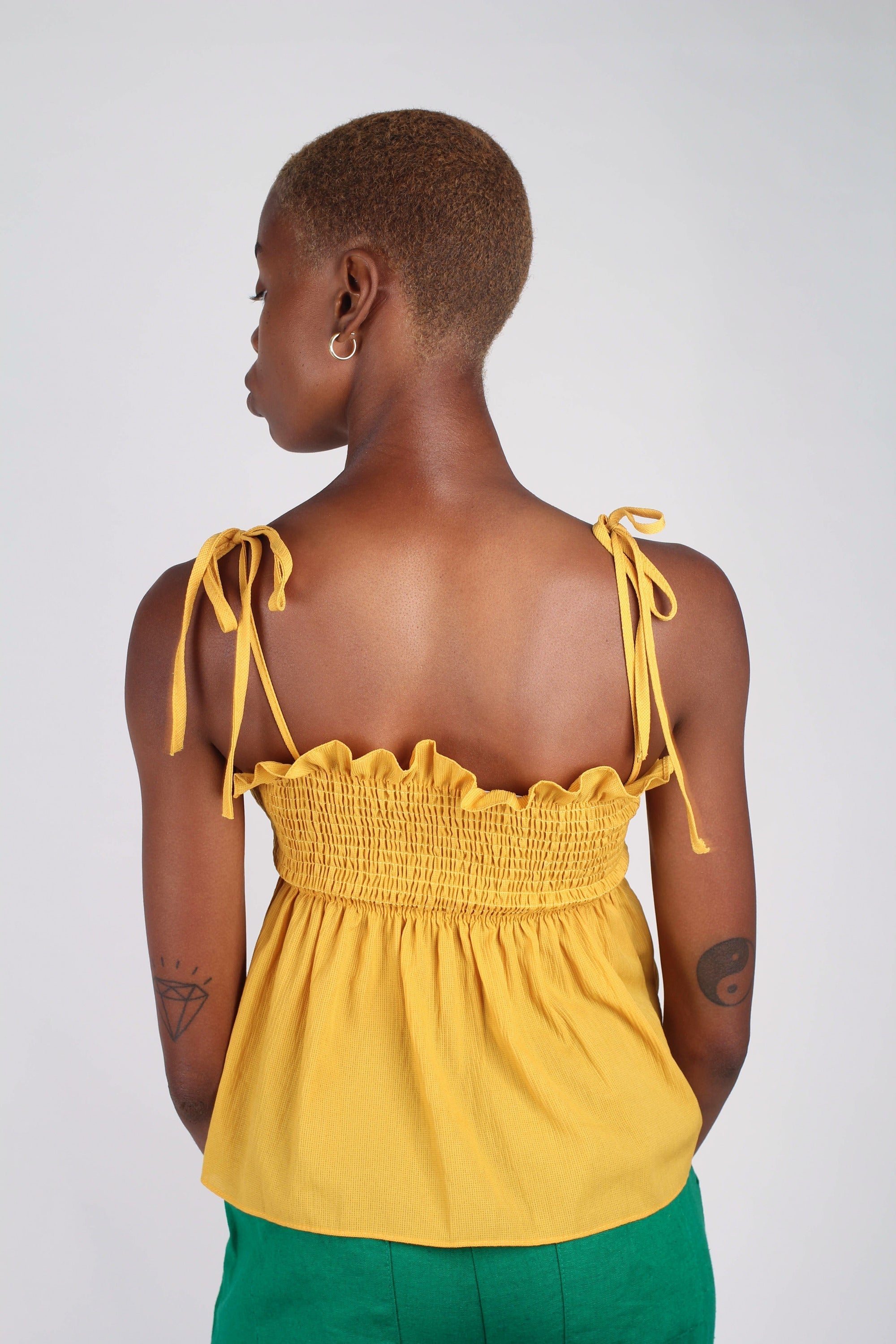 Yellow ruched fit and flare tie shoulder tank