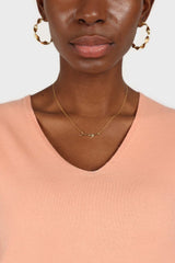 Pale orange V-neck short sleeved knit top