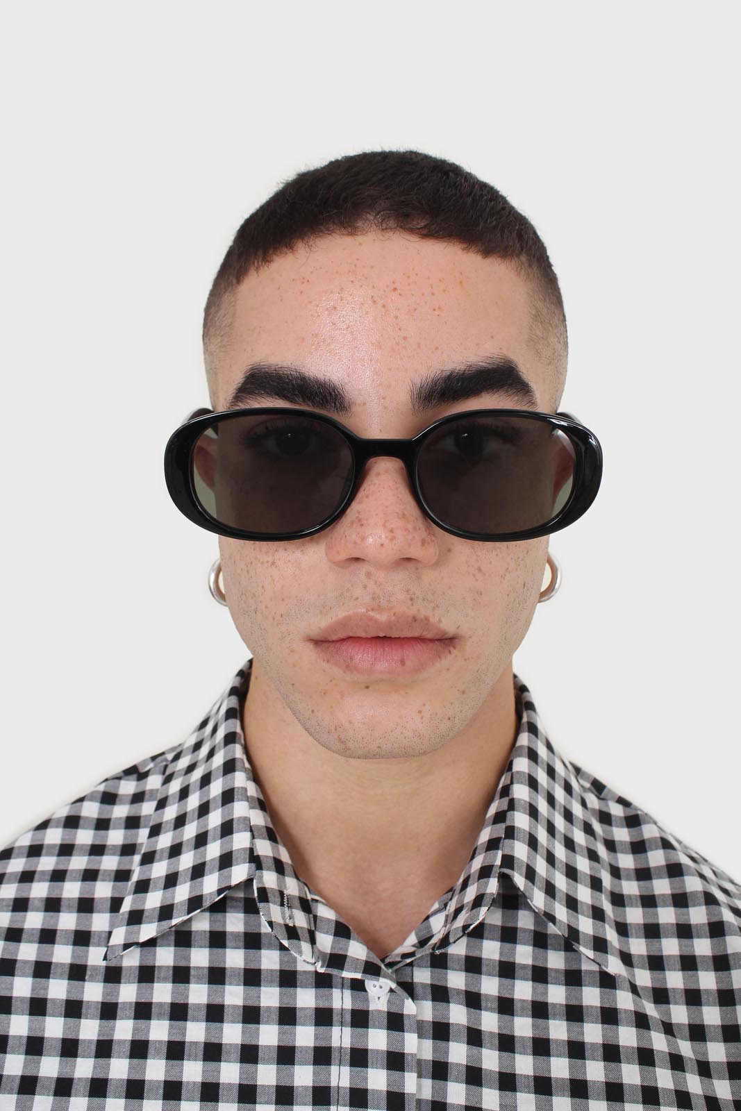 All black thick oval frame sunglasses