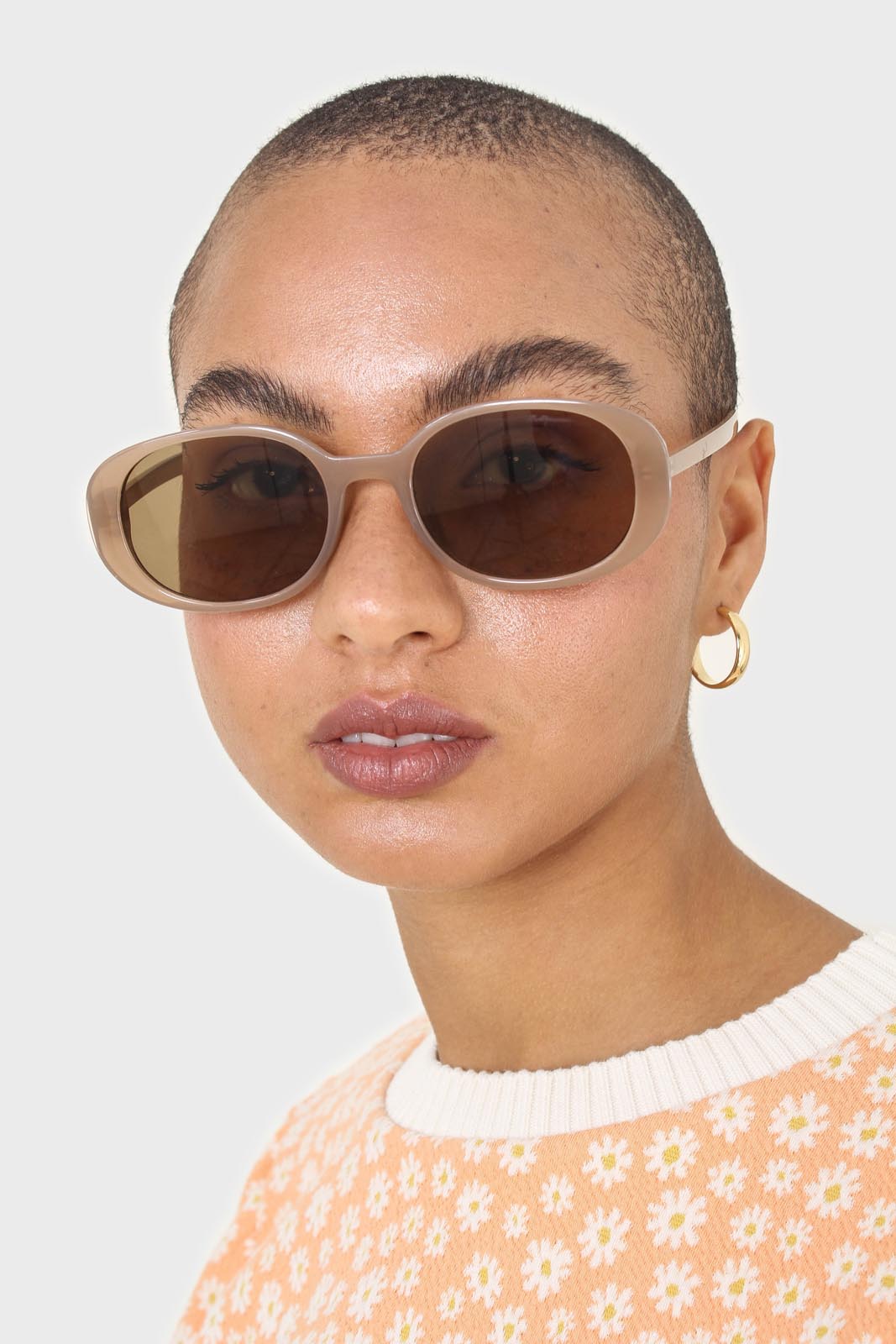 All beige thick oval frame sunglasses