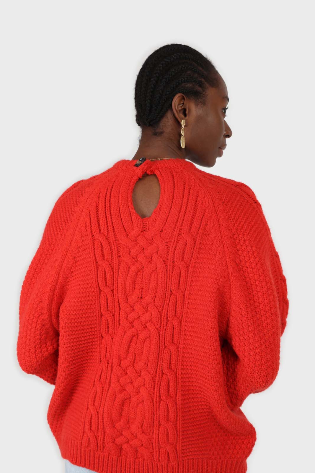 Bright red chunky cable knit balloon sleeved jumper