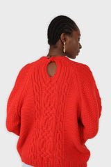Bright red chunky cable knit balloon sleeved jumper