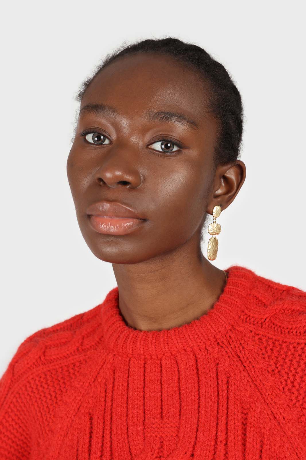 Bright red chunky cable knit balloon sleeved jumper