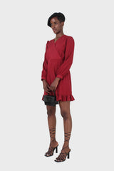 Red polka dot wrap front long sleeved mini dress