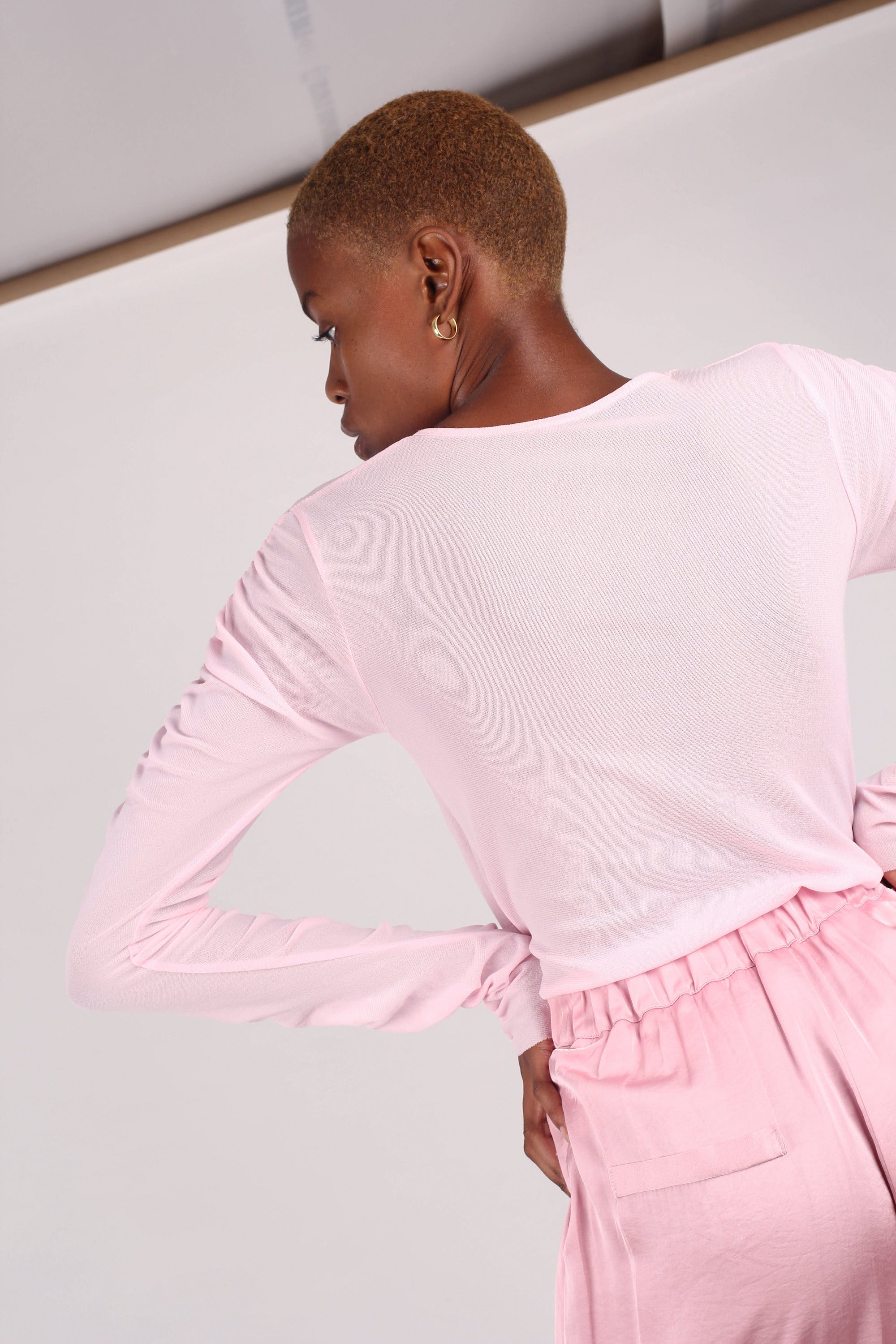 Pale pink sheer curved shirring top