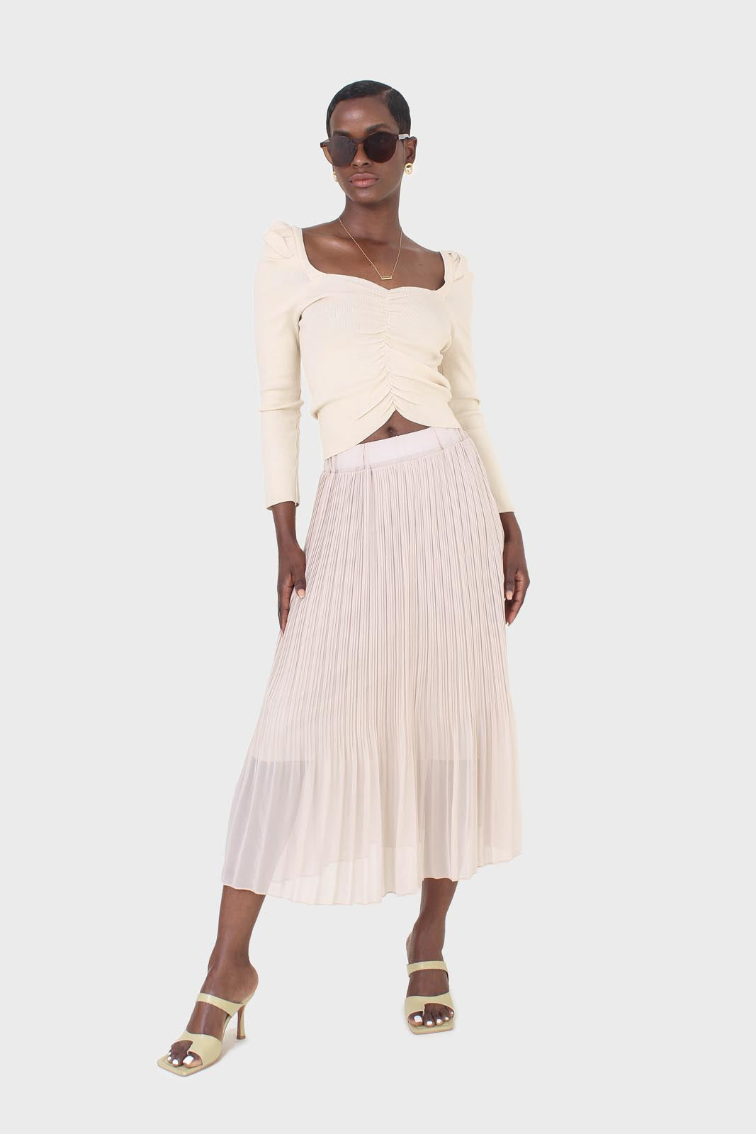 Beige gathered front long sleeved knit top