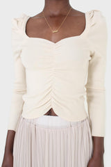 Beige gathered front long sleeved knit top