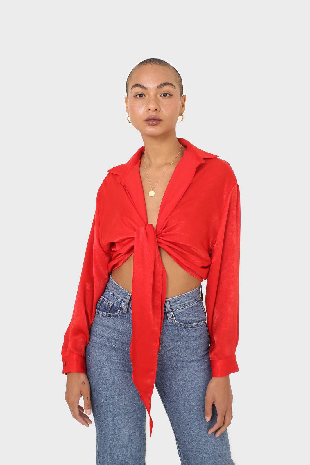Bright red textured silky plunging tie front shirt