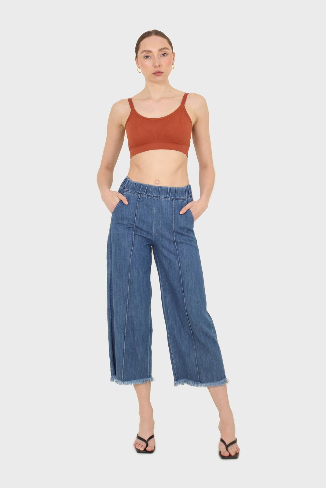 Blue pin tuck raw hem jeans
