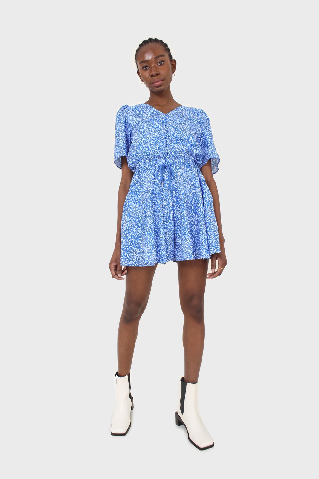 Blue and white floral print tie waist romper