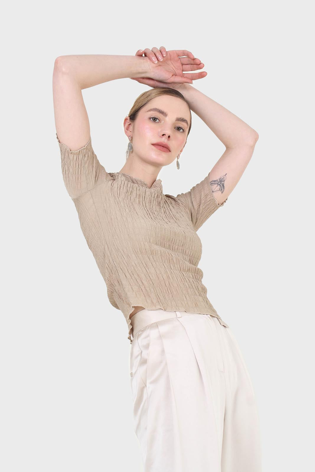 Beige smocked fitted short sleeved top