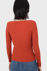 Orange cross front chest knit top