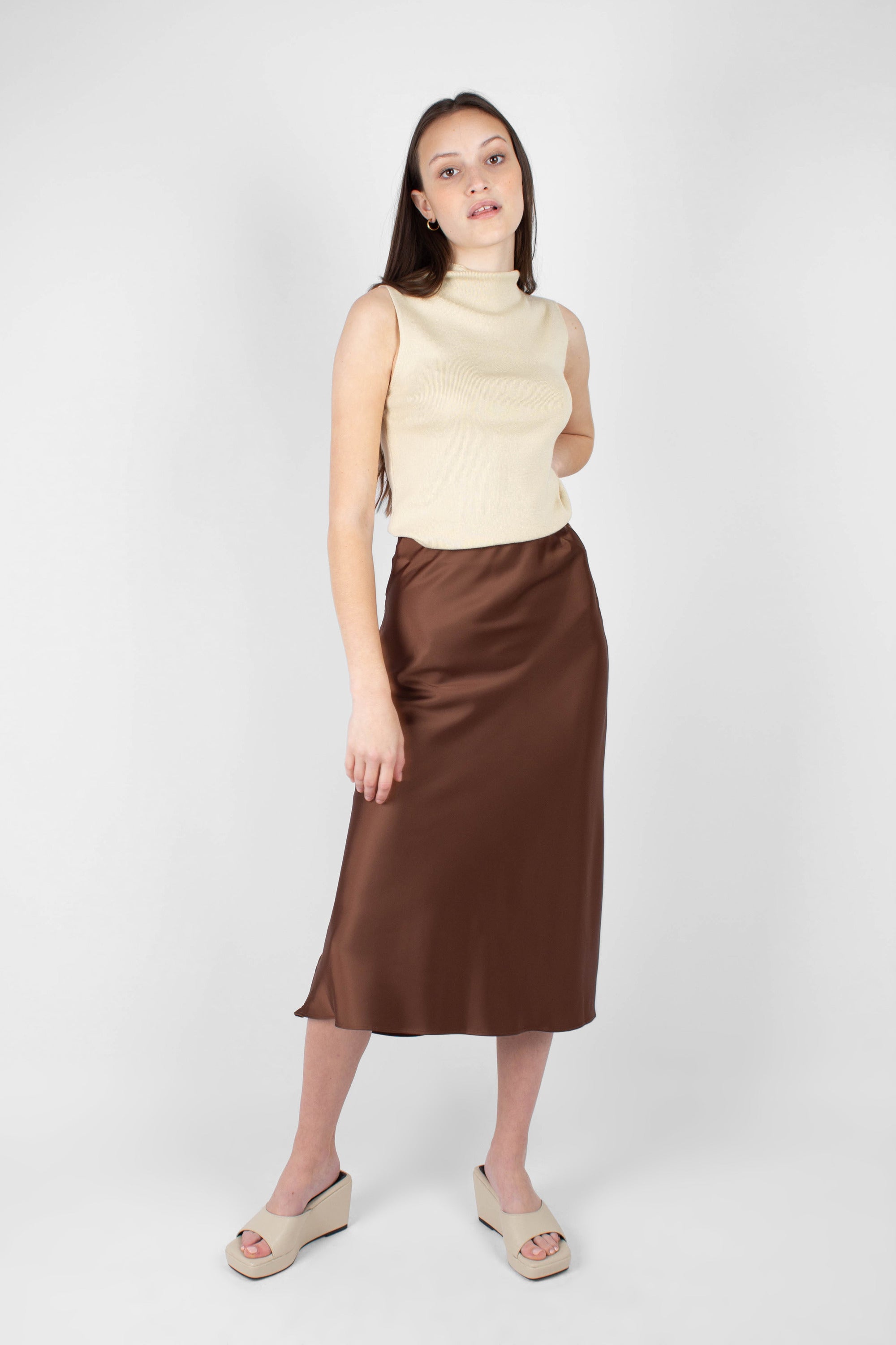 Light beige sleeveless mock neck knit tank