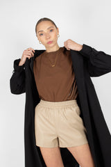 Beige vegan leather running shorts