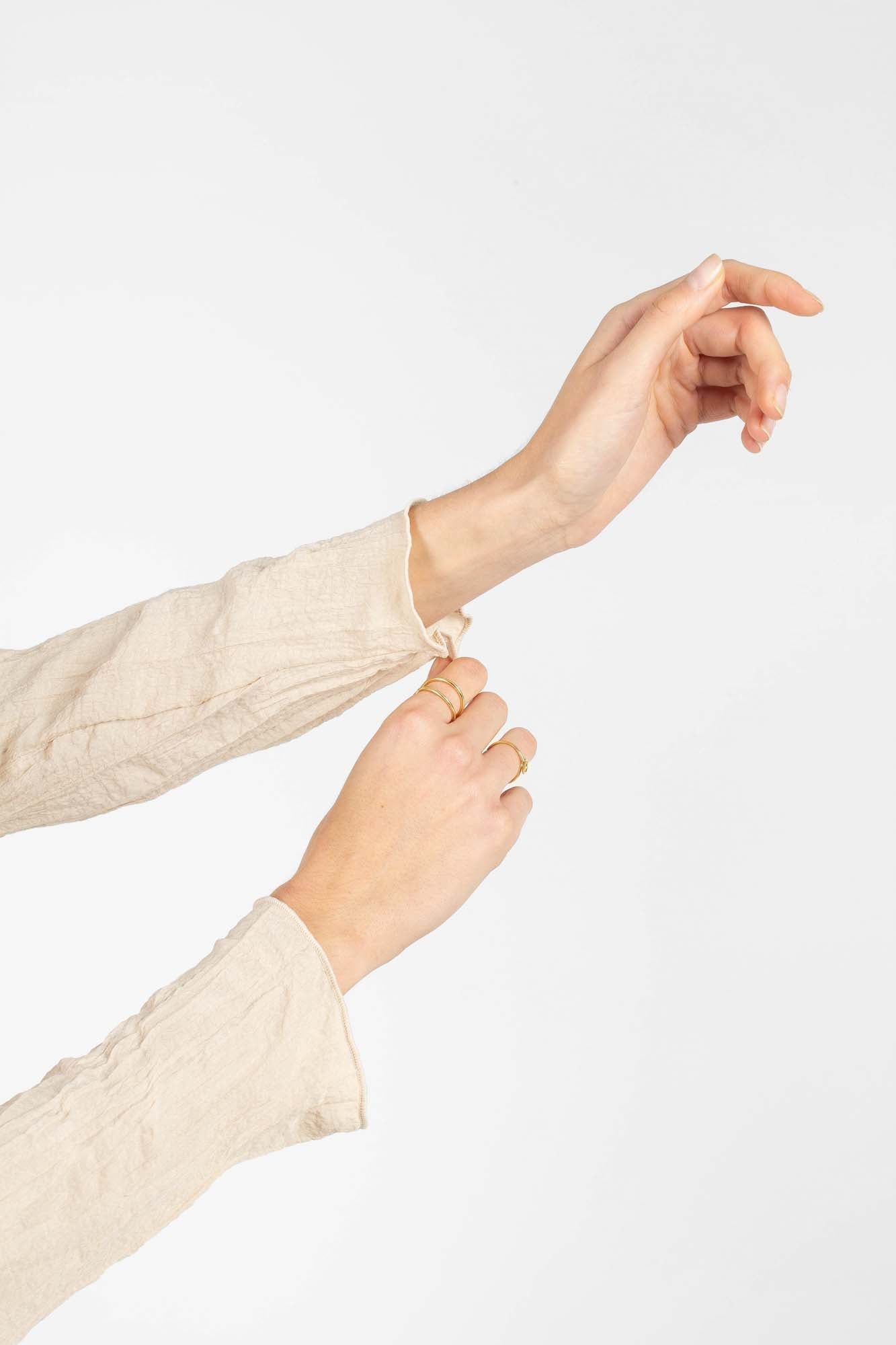 Beige wrinkled long sleeved top