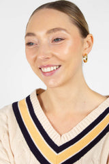 Cream and yellow V-neck cableknit jumper