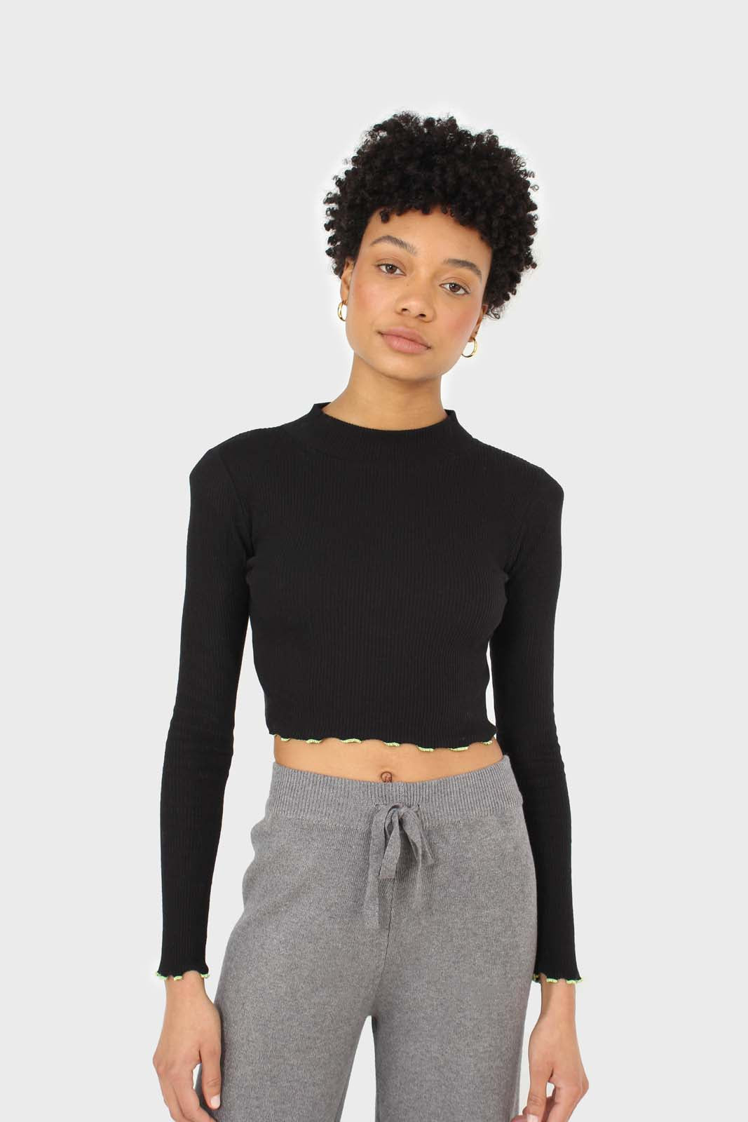 Black and neon ruffle trim cropped top