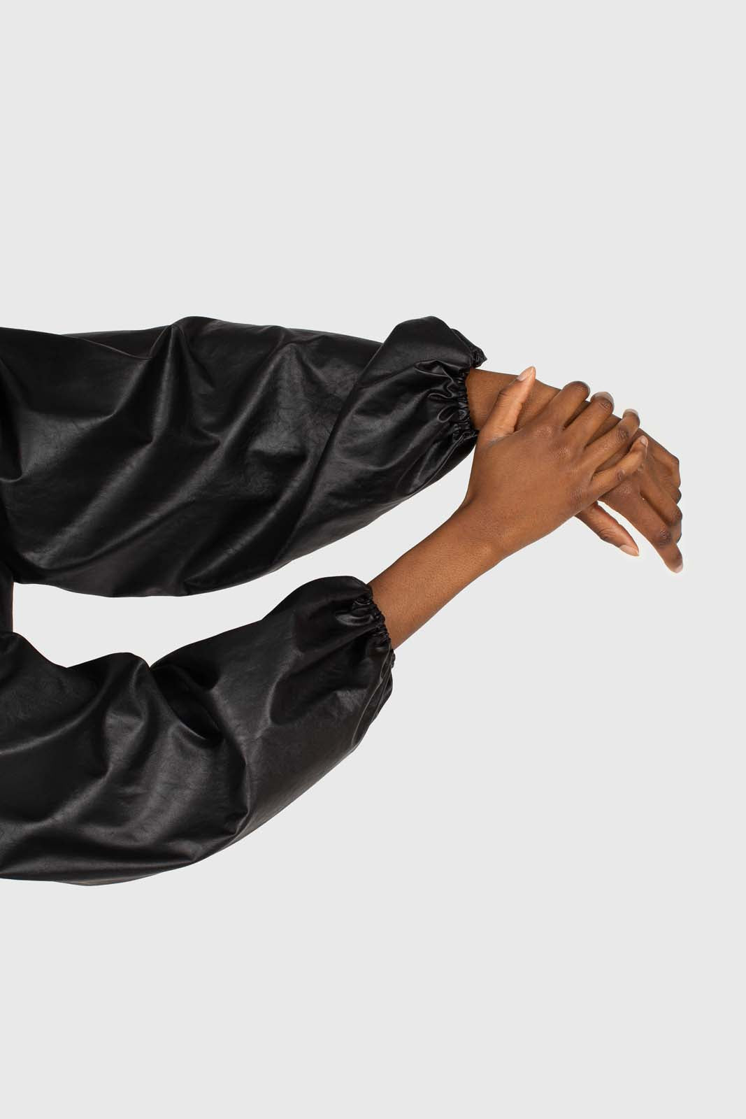 Black vegan leather v-neck puff sleeved blouse