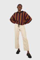 Bold red orange and blue zig-zag jumper