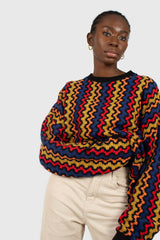 Bold red orange and blue zig-zag jumper