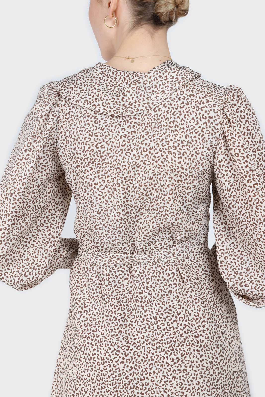 Ivory and brown animal print ruffle trim wrap dress
