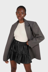 Black shiny vegan leather tiered mini skirt