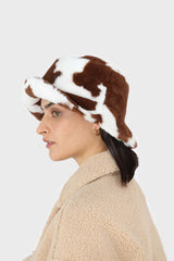 White and brown cow print faux fur bucket hat