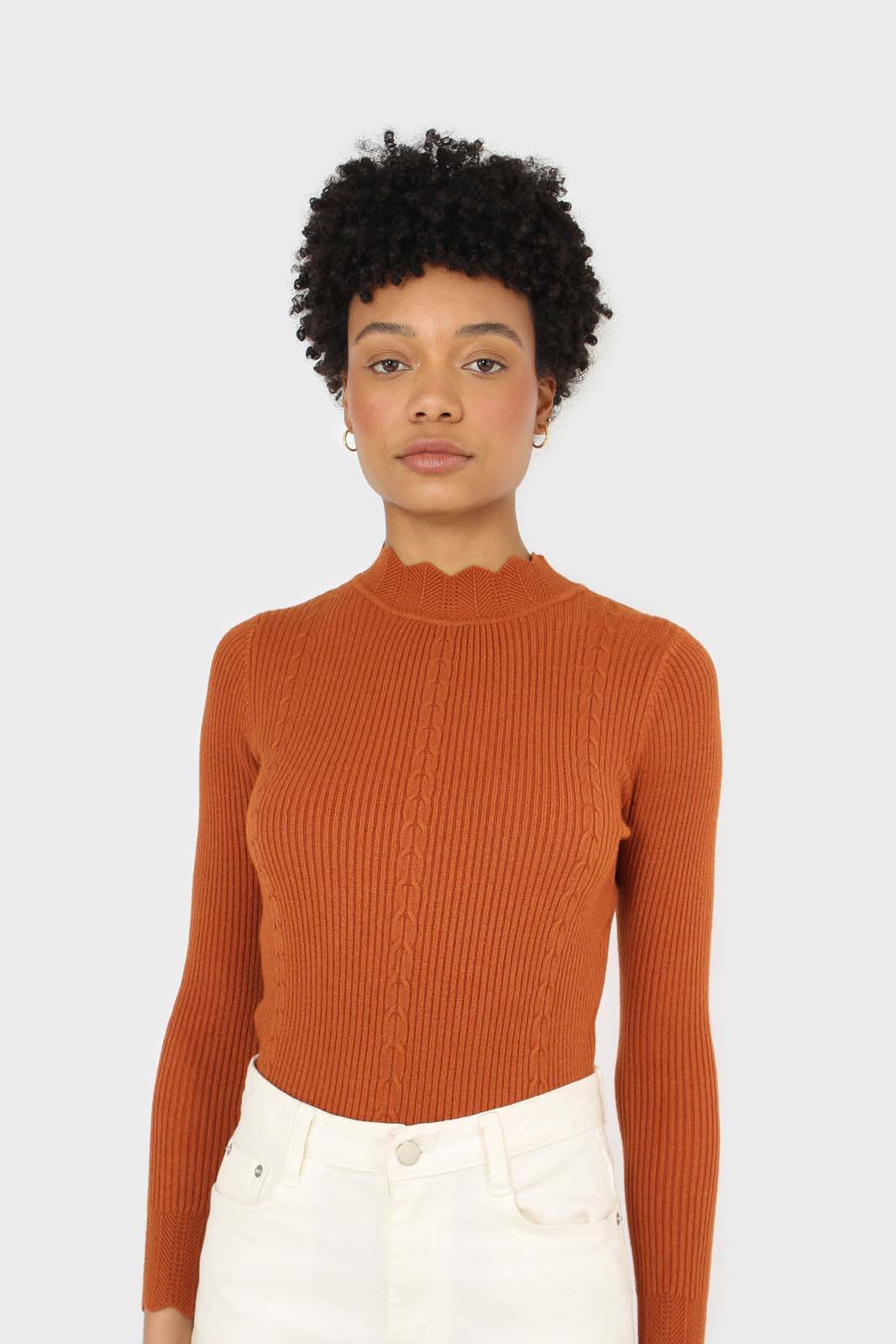 Burnt orange scalloped mock neck knit top
