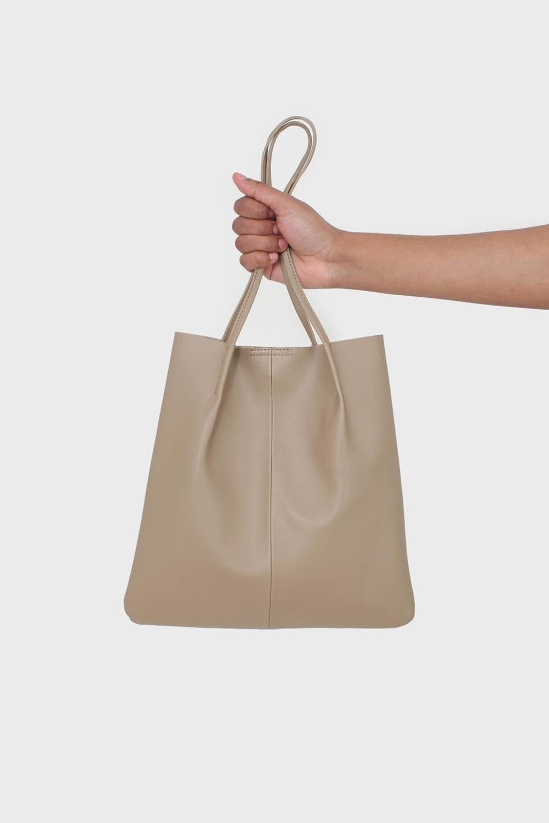 Light beige vegan leather pinched strap tote bag