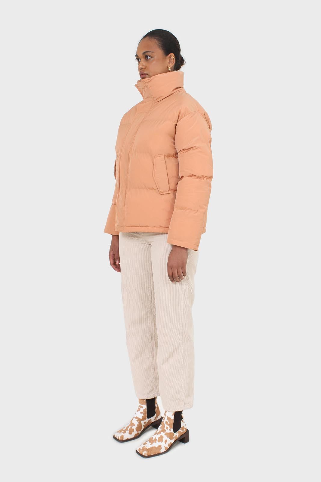 Pale orange puffer jacket