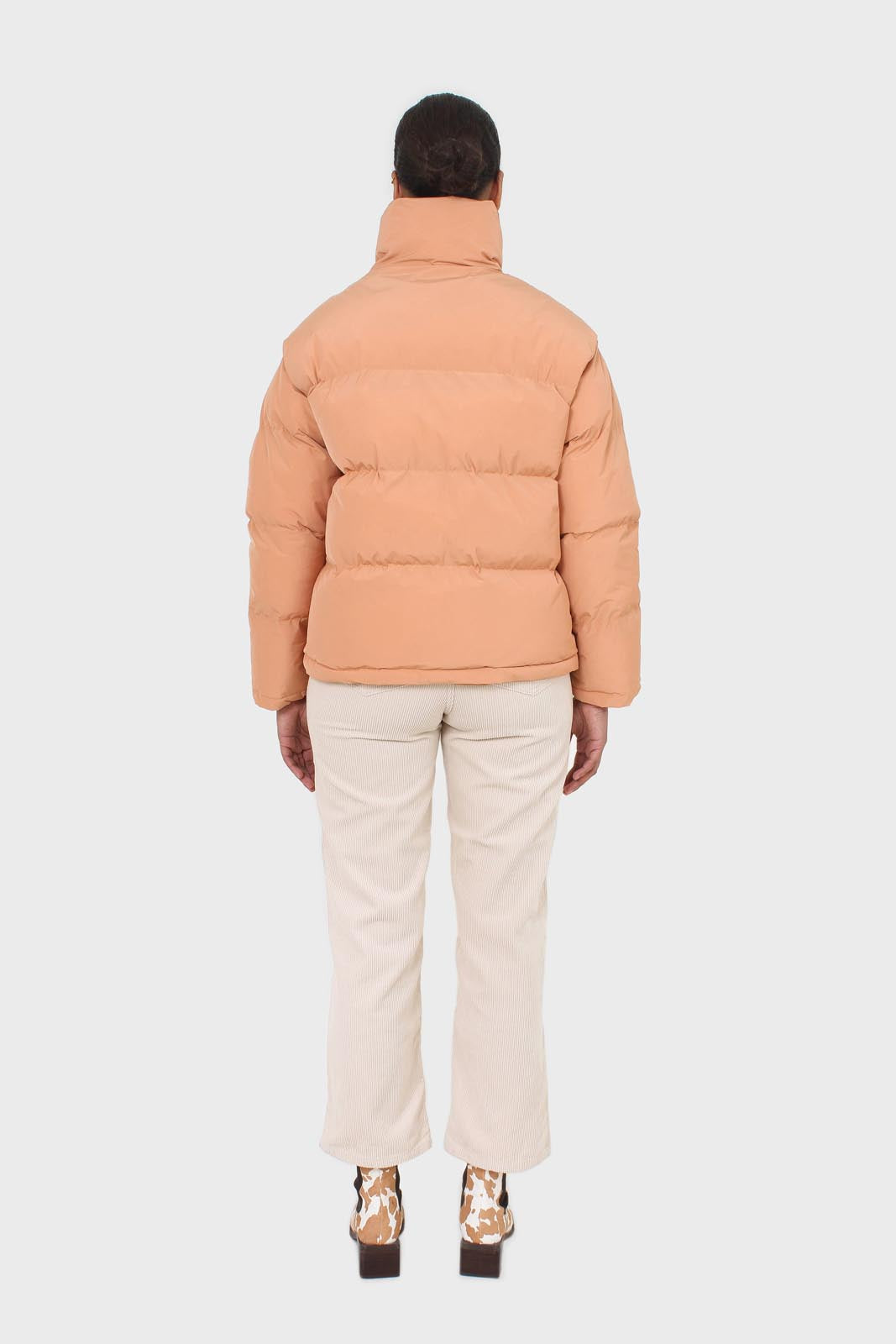 Pale orange puffer jacket