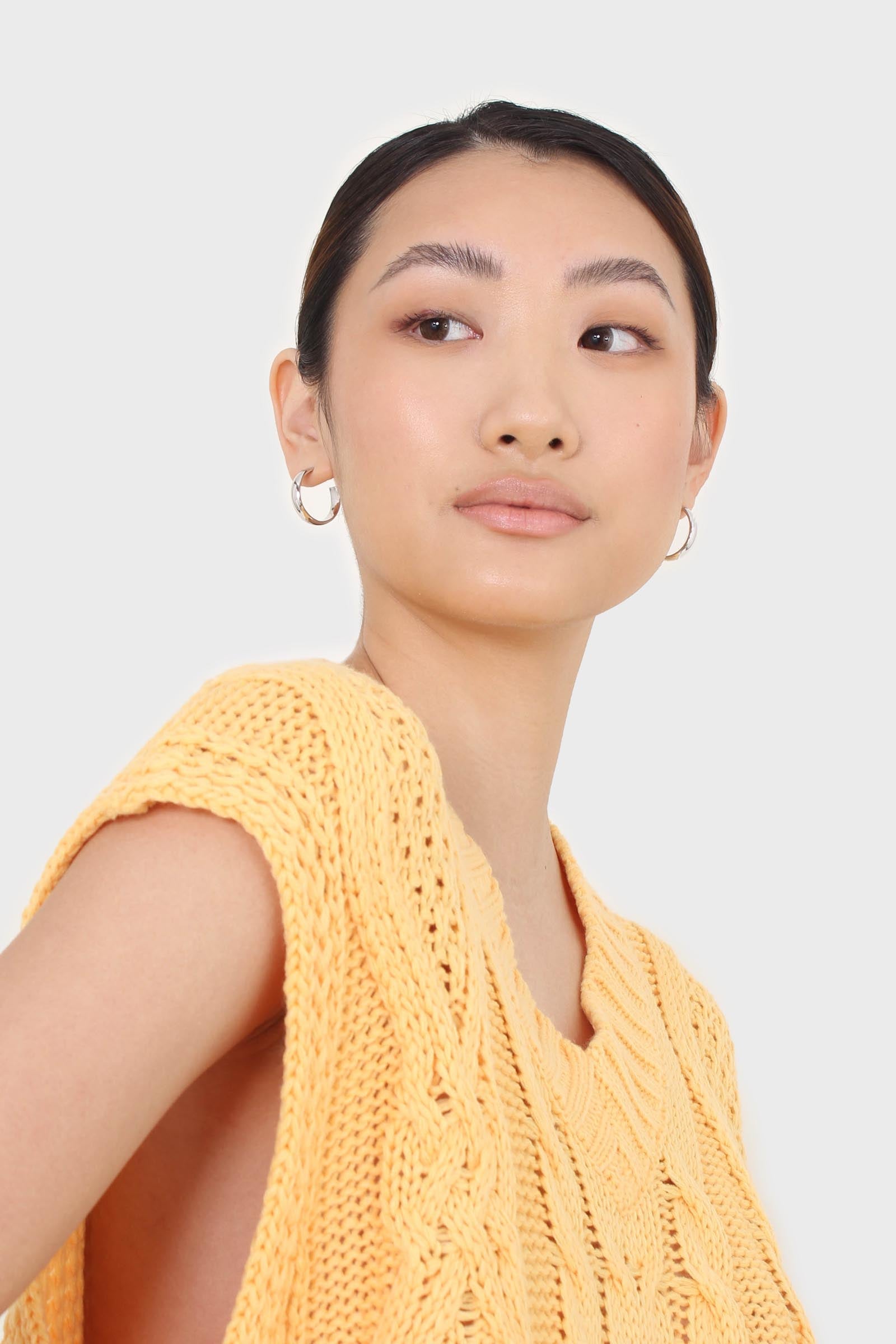 Bright orange cableknit sweater vest
