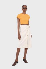 Ivory faux side button midi skirt