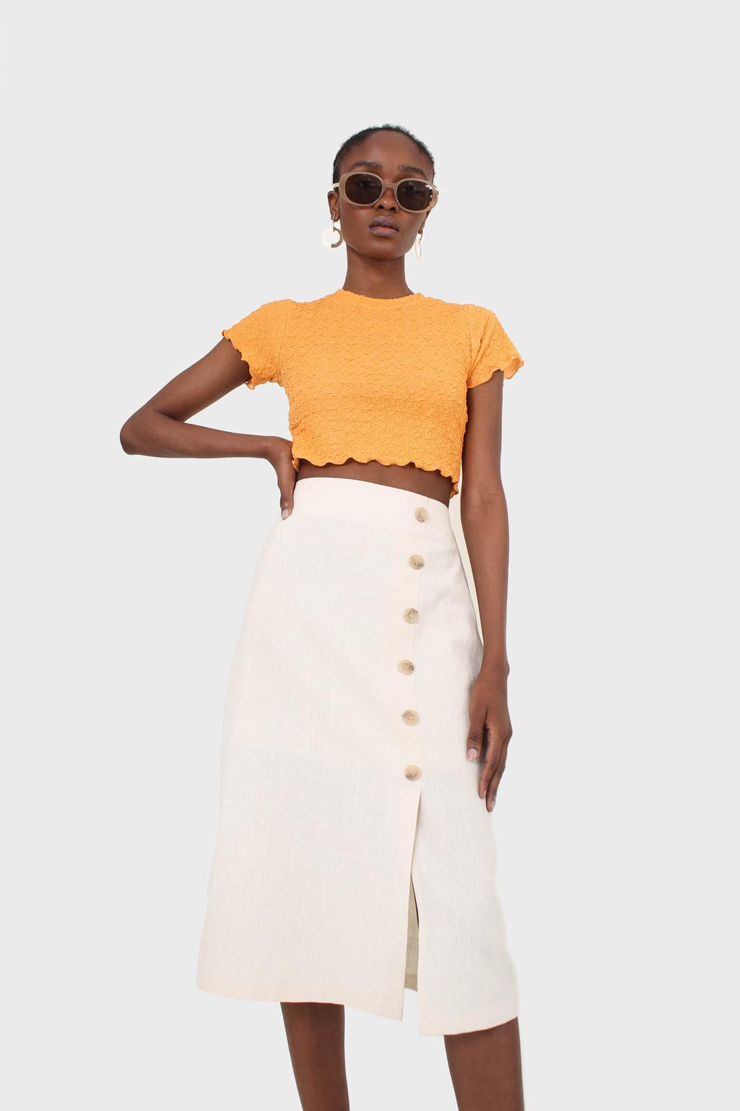 Ivory faux side button midi skirt