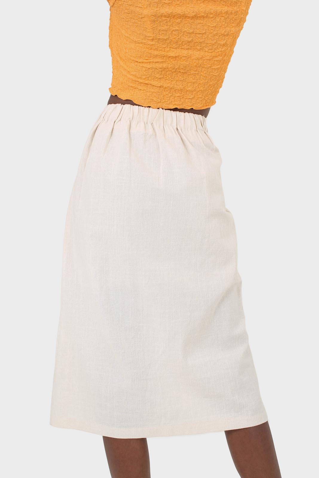 Ivory faux side button midi skirt