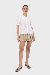 Beige waxed pleated mini skirt
